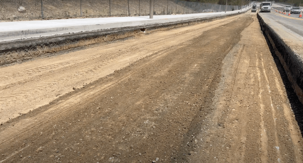 Clean dirt excavation cut made with a Wirtgen milling machine showing depth and grade after full-depth removal.